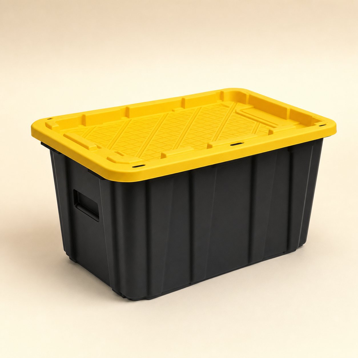 A single heavy-duty 27-gallon moving tote with a matte black ribbed base and a bright yellow recessed snap-on lid, photographed on an ivory studio background.